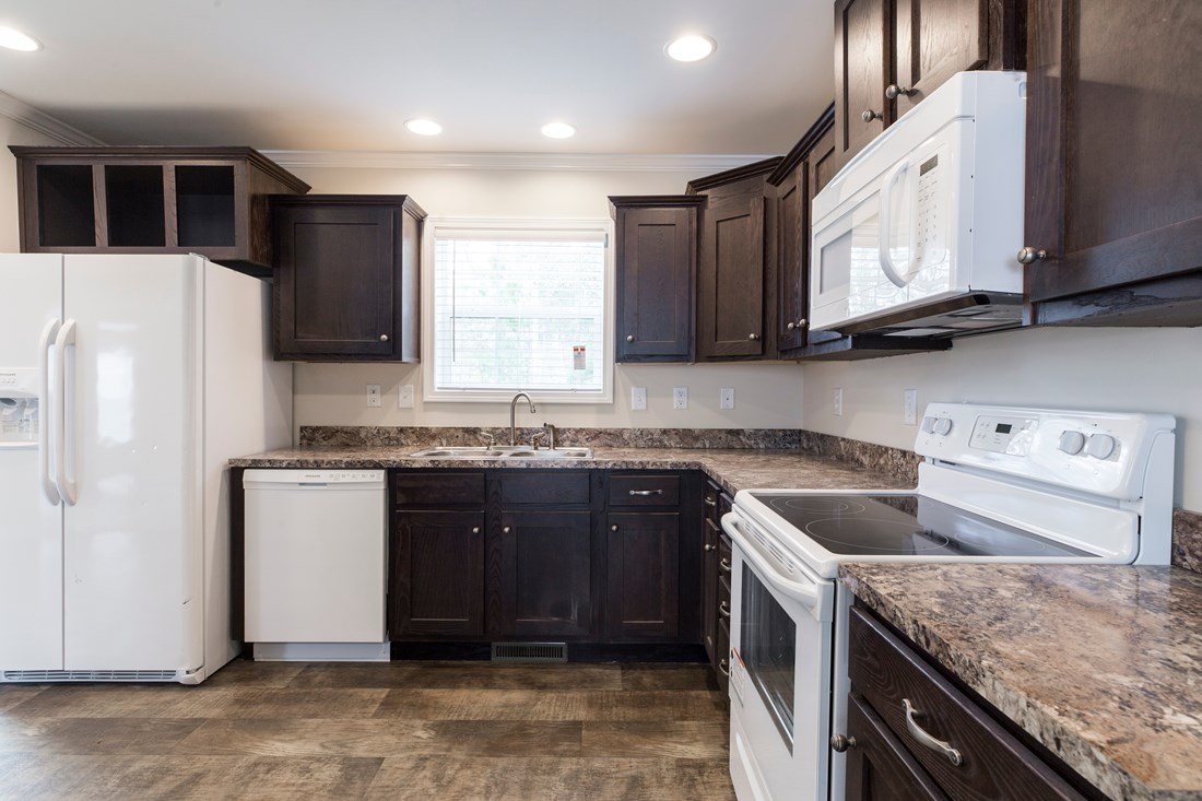 The 2089 52X28 3+2 HERITAGE Kitchen. This Manufactured Mobile Home features 3 bedrooms and 2 baths.