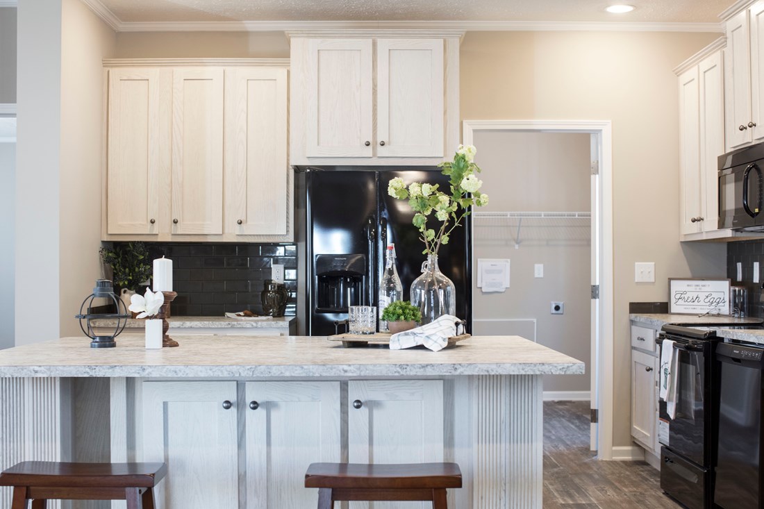 The 3338 HERITAGE Kitchen. This Manufactured Mobile Home features 4 bedrooms and 2 baths.