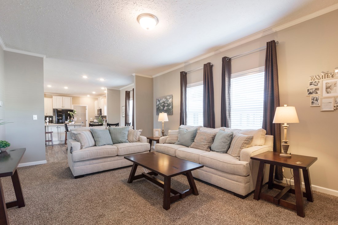 The 3338 HERITAGE Living Room. This Manufactured Mobile Home features 4 bedrooms and 2 baths.
