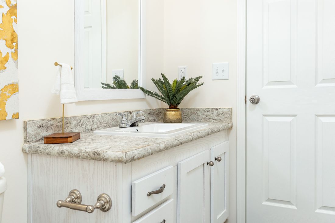 The 1714 HERITAGE Guest Bathroom. This Manufactured Mobile Home features 3 bedrooms and 2 baths.