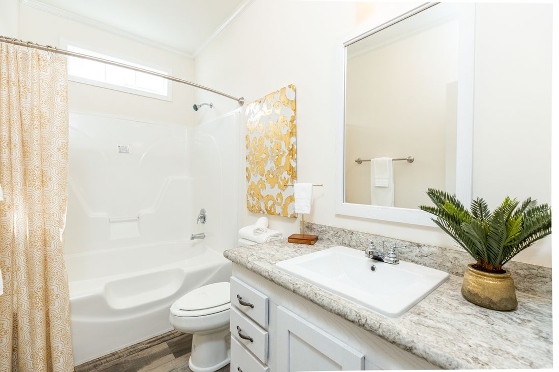 The 1714 HERITAGE Guest Bathroom. This Manufactured Mobile Home features 3 bedrooms and 2 baths.